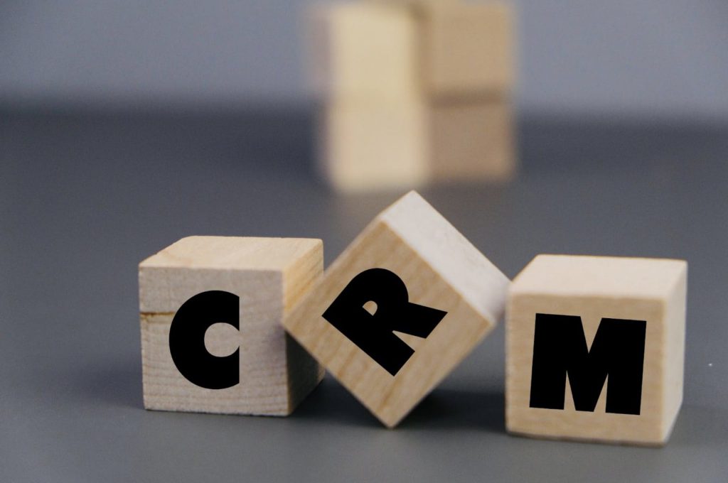 CRM on wooden blocks | CRM vs. ERP