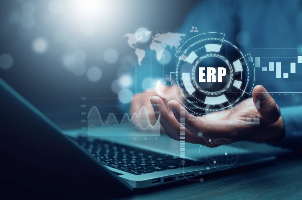 Hand holding ERP data | CRM vs. ERP