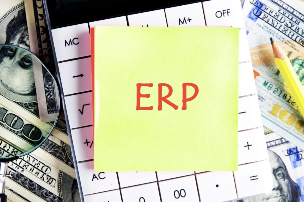 ERP written on post-it note | CRM vs. ERP