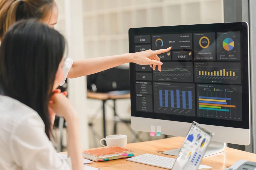 Two coworkers pointing at graphs on a computer | Einstein Activity Capture limitations